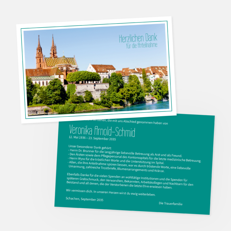 Eine Dankeskarte und eine Todesanzeige für Veronika Arnold-Schmid. Die Karte zeigt ein Foto des Basler Münsters und Dächer an einem Fluss, mit dem Text "Herzlichen Dank für die Anteilnahme" in blauer Schrift.